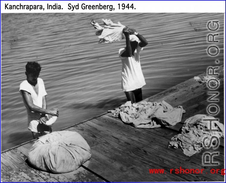 Laundry being done outside in Kanchrapara, India, 1944.  Photo by Syd Greenberg.