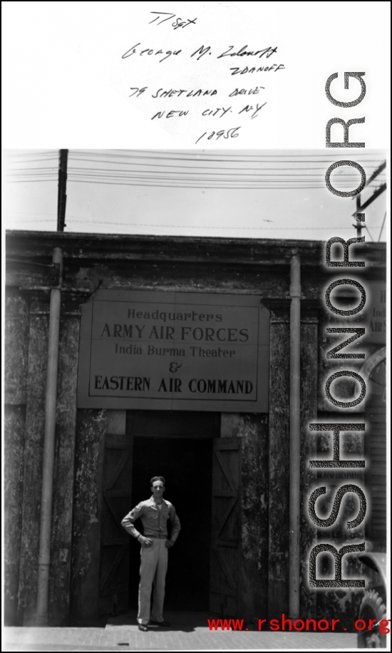 T/Sgt. George M. Zdanoff standing at HQ at Hastings Mills, India, during WWII.