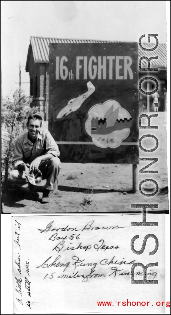 Gordon Brown kneels before 16th Fighter Group Sign At Chenggong (Chengkung), 15 miles from Kunming, during WWII. In Chinese the sign says "Great Wall In The Air" ("空中长城").  Photo from Gordon Brown.