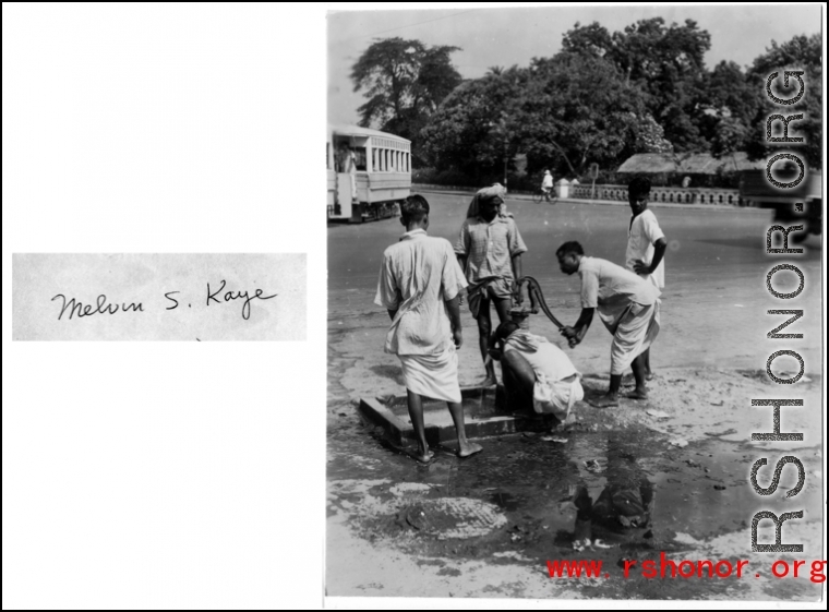 Civilians pump water in a public well in India during WWII.  Photo from Melvin S. Kaye.