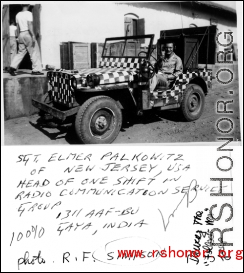 Sgt. Elmer Palkowitz, Radio Communication Service Group, 1311th AAFBU, Gaya, sitting in a black-white checked "Follow-Me" jeep in India during WWII.  Photo from R. F. Simpson.