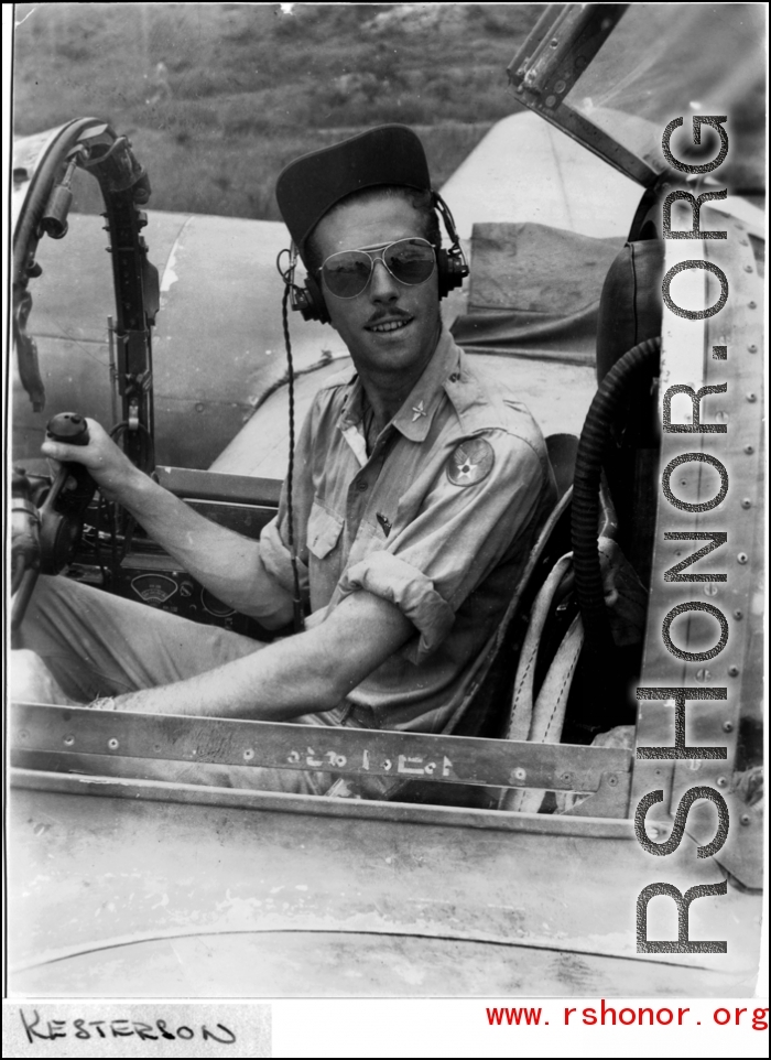 A GI sits in the cockpit of an airplane in the CBI during WWII. Kesterson.