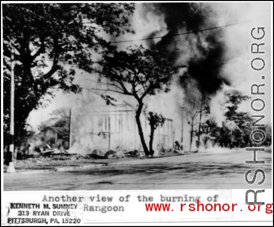 View of a building burning in Rangoon, Burma. In the CBI during WWII.