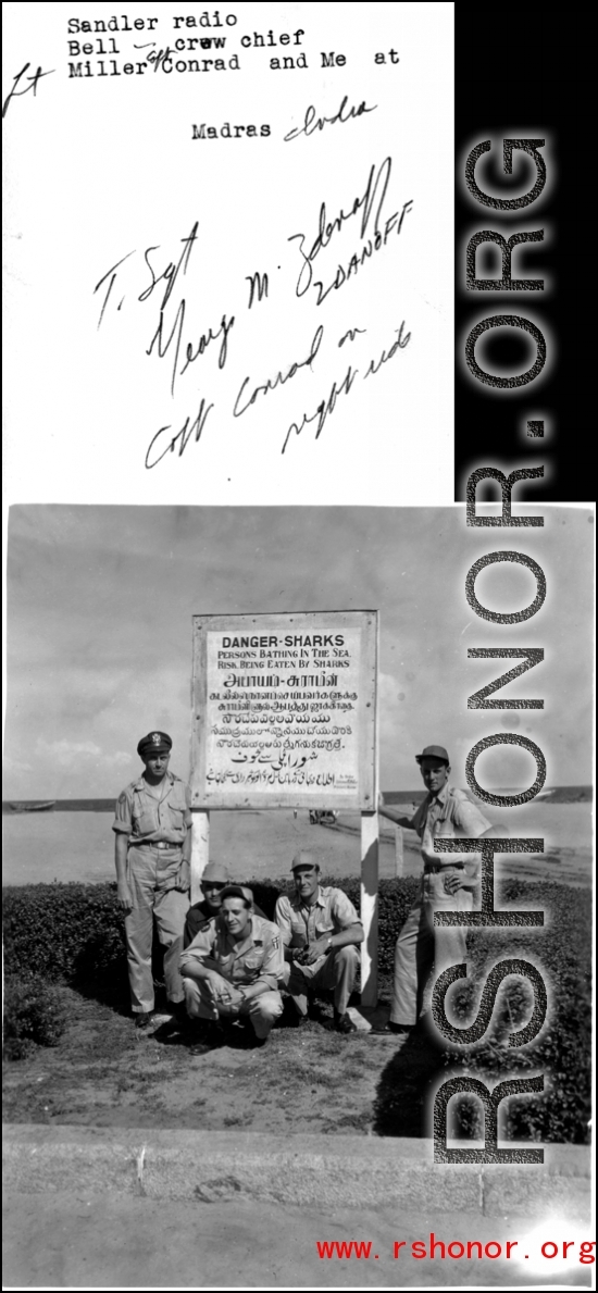 A crew of American GIs in front of a sign at Madras, India, during WWII, including Sandler (radio), Bell (Crew Chief), Lt. Miller, Capt. Conrad, and George Zdanoff.  Photo from George M. Zdanoff.