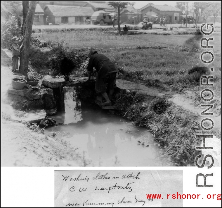 Chinese civilian washing clothes in ditch near Kunming, China, May 1945. Photo by Leipnitz.