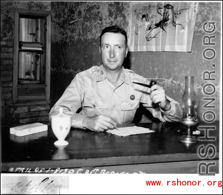A US Army Air Force captain at a desk in China in WWII, in April 1945.