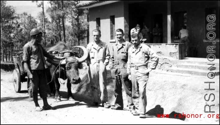 GIs and local farmer with ox cart at barracks area in Yangkai, Spring 1945. Unknown, Bill Bryan, Richard Hill, Clayton E. "Fred" Nash, Aspinwall, Gilliland, Alexander, Chisholm.
