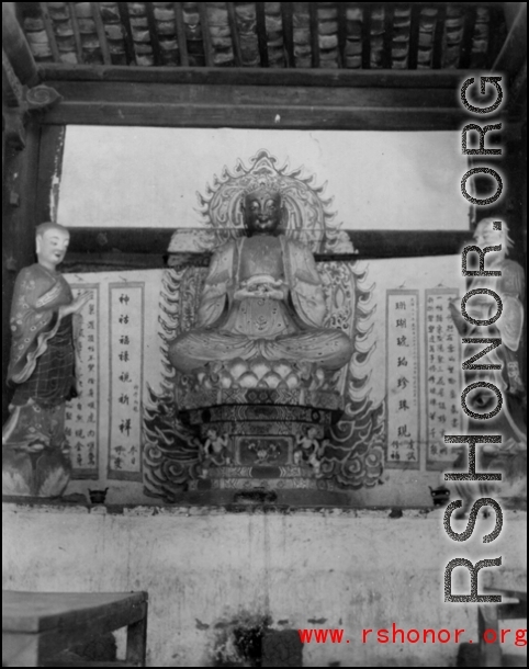 A Buddhist statue in China during WWII.