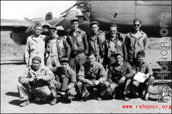 Ringer Squadron personnel: Lecher, Schmidt, Clark, Penny, Routon; rear; Bryan, Gornick, Gebhart, Williams, Vollmer, Arndt at Yangkai, Early 1945, with a B-25 in the background.  From the collection of Frank Bates.