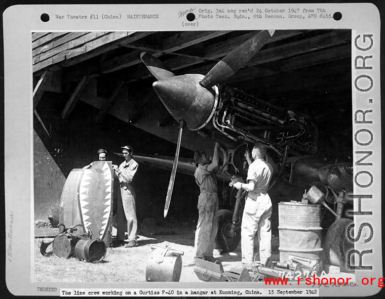 The line crew working on a Curtiss P-40 in a hanger at Kunming, China. 15 September 1942.