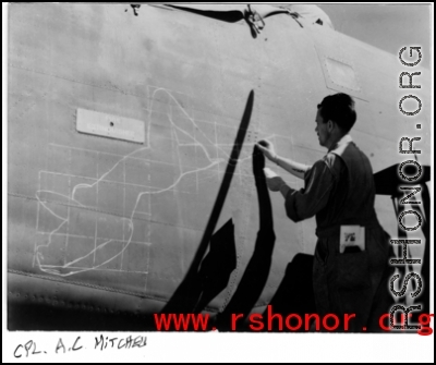 Nose art being sketched out on a B-24 bomber--probably on "Daisy May." In the CBI during WWII.  Cpl. A. C. Mitchell.