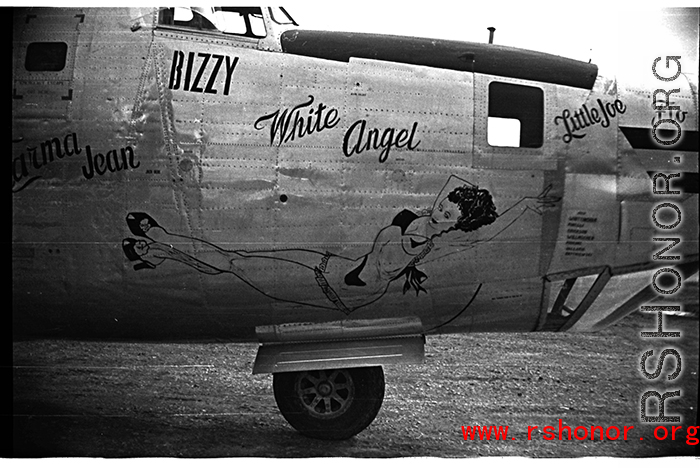 Nose art of a Consolidated C-109 (a modification of the B-24 bomber) "White Angel" in the CBI during WWII. The cockpit window is labeled with a large uppercase "BIZZY." Probably serial #44-49059.