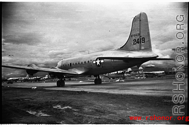A C-54, tail #272419. At an American air base in WWII in Yunnan province, China, most likely around the Luliang air base area.