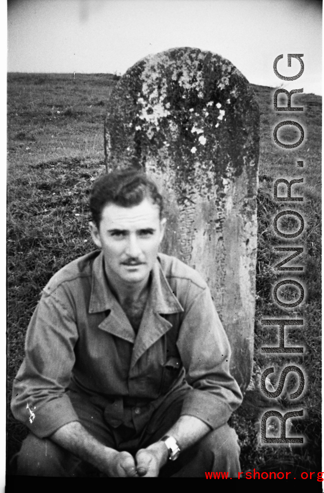 GI with grave marker in Yunnan, during WWII.