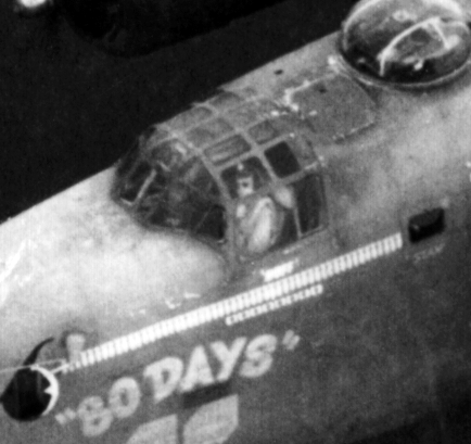 An American flyer in the cockpit of B-24 "80 Days."