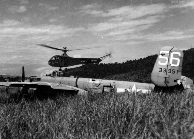 Part of helicopter salvage--the testing of new helicopter technology, with a YR-4B​​​​​​​ hovering near the​ B-25J "Cornhusker," serial #43-3951, hard on the ground in China.  (Image courtesy of world war photos.)