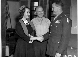 Miss Lily Pons of opera and radio fame, along with husband Andre Kostelanetz, meets C. L. Chennault on February 15, 1945, after her tour of American airfields in China.