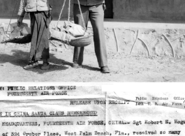 Sgt. Robert E. Hogue of Florida gets a Christmas haul of presents, a record of 13 packages. He hired a Chinese boy to help him carry them.