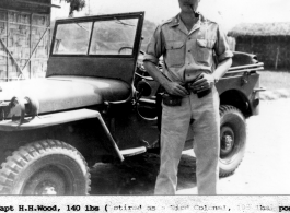 Capt. H. H. Wood poses with his jeep at Ledo, Assam. 478th Quartermaster Regiment, Truck.