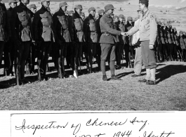 American officer, with his translator, inspecting Chinese unit and being welcomed warmly near Mitu, in 1944, in the CBI during WWII.  Official photo of U. S. Army Signal Corps