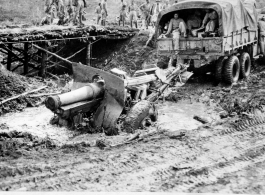 Pulling truck and 155mm Howitzer through mud on Burma Road, February 15, 1945.   US Army Photo.  Image from Raimon B. Cary.