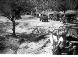 Part of 450 truck convoy with armored protection moving toward Razmak, Northwest Frontier Province, India. July 28, 1944.