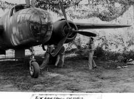 A ground crew preps a B-25 for flight in the CBI during WWII. East India. "Sgt. Marshall Wikey went on flight to take photos."