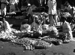 An open-air produce market in India or Burma, during WWII.  Photo from Glenn S. Hensley.
