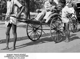 Sgt. Bob Travis Keagle shows his camera to a rickshaw walla in Calcutta, India, in 1944. 40th Photographic Reconnaissance Squadron.  Photo from Robert Travis Keagle.