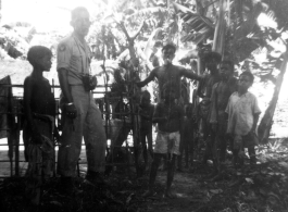 A camera-toting GI with local people in Misamari, India.  Local images provided to Ex-CBI Roundup by "P. Noel" showing local people and scenes around Misamari, India.    In the CBI during WWII. 