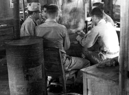 GIs play a card game in the barracks in the CBI during WWII.  Photo from Jesse D. Newman.