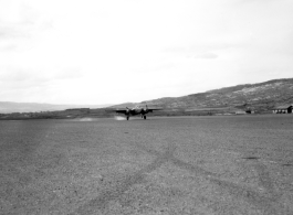 B-25 tail number 435, of the Ringer Squadron, above a runway in Yunnan.  From the collection of Wozniak, combat photographer for the 491st Bomb Squadron, in the CBI.