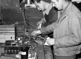 American GIs in the CBI at work on electronic gear during WWII.  Notice the case labeled to "Lt. R. V. Zalouder."
