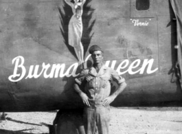 A US serviceman standing before the B-24 "Burma Queen" in the CBI.