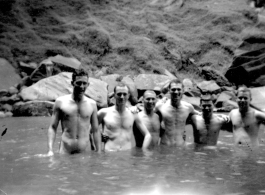"This Is A Bunch Of 396th Guys Taking Advantage Of A Chance To Take A Bath And Enjoy A Swim At The Same Time. Sorry I Can Only Name Four Of Them. John Marlatt, Jr.,  and Dale Souder Are the First Two, And Ernie Estes And Marlin Reese At The End Of The Line."