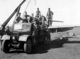 12th Air Service Group mechanics salvage a P-51 fighter in China during WWII.