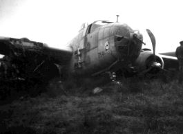 12th Air Service Group mechanics salvage what they can from crashed B-25 in China during WWII.
