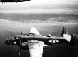 In this intriguing photo, two B-25Cs of the 491st Bomb Squadron fly near the coastline in the CBI. Despite significant damage to the photo itself, still the content is very eye catching, so much that one wonders who the men in the turret and cockpit were.