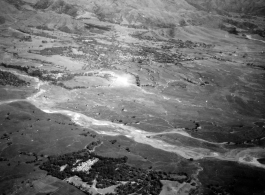 Smoke rises on the ground after an attack by American B-25s in either SW China, Indochina, or the Burma area.  This might be fairly close to Tengchong in China.