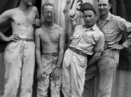 Men of the 12th Air Service Group in China goof for the camera: Left to right, Brantl, Wolfe, ? , ?