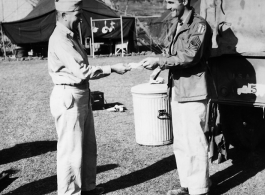 Major Claude R. Hannah and 1st/Sgt. Klein interact at a camp in India during WWII.   From the collection of David Firman, 61st Air Service Group.