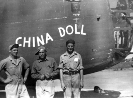 Four US servicemen in front of the B-24 "China Doll".  Note the fourth face in the small port above, labeled "Tiff".   From the collection of Robert H. Zolbe.