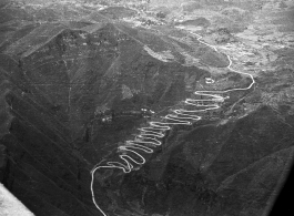 Aerial view of road in western Guizhou province, with famous multiple turns. During WWII.