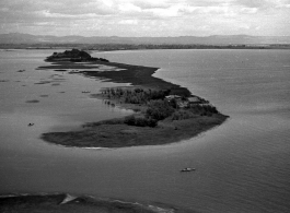 View over Dianchi Lake (滇池) outside of Kunming, China, during WWII. A few small boats dot the water surface. 