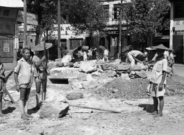 Chinese workers and Nationalist soldiers build a fortified bunker at a street corner in a town in Guangxi province, during WWII, in the summer or fall of 1944 during the Japanese push south in the Ichigo campaign.