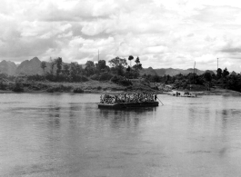 Retreating by ferry near Lingling in the face of the Japanese advance in the fall of 1944, crossing a river by ferry.