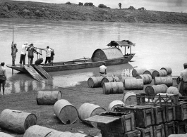 Shipping bombs and fuel by boat and hard human labor, near Lingling. During WWII.  From the collection of Hal Geer.