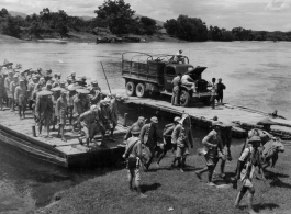 Chinese troops cross the river at Lingling by barge during retreat in the face of the Japanese Ichigo campaign advances in the summer/fall of 1944.