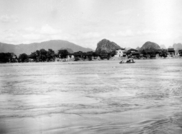 A river crossing, probably near Liuzhou (Liuchow) city, Guangxi province, China, during WWII.  Note the horse or mule riding the small boat.  Selig Seidler was a member of the 16th Combat Camera Unit in the CBI during WWII.
