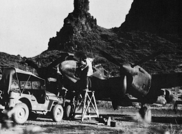 A 21st Photographic Reconnaissance Squadron F-5 being serviced in Guangxi province, at either Liuzhou or Guilin.  Original can be found at National Archives and Records Administration. Caption for the photo is: "Camera Repairmen Of The 21St Photographic Reconnaissance Sqd. Work On A Lockheed F-5A Reconnaissance Plane In A Natural Revetment Formed By The Limestone Buttes At A Forward Base In China." (Info thanks to TexLonghorn)